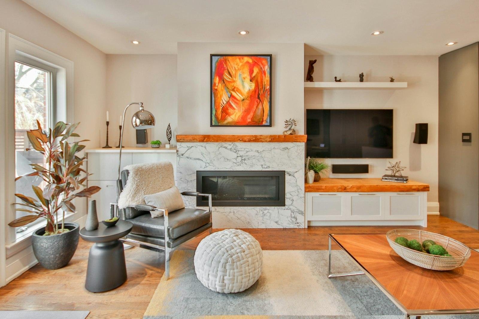 Living room with a large framed canvas above the fireplace